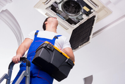 Technician Servicing AC